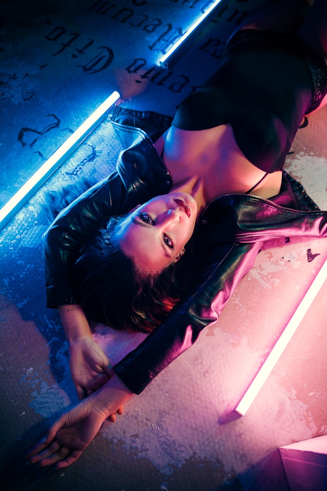 woman in black lingerie lying on bed